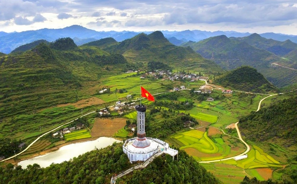 Locals recommend climbing to the small hill near the tower